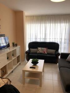 Posezení v ubytování APARTAMENTO A 50 METROS DE LA PLAYA DE SILGAR