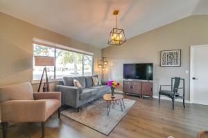 a living room with a couch and a tv at Florida Vacation Rental with Enclosed Porch! in Beverly Hills