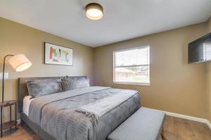 a bedroom with a large bed and a window at Florida Vacation Rental with Enclosed Porch! in Beverly Hills