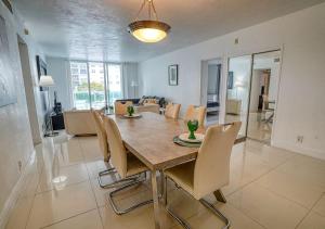 a dining room table and chairs in a living room at Miami Hollywood 2 Bedroom 2 Bath Condo 002-22bmar in Hollywood