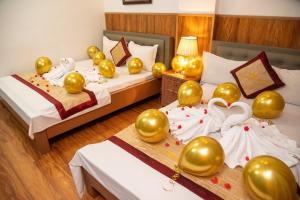 Postel nebo postele na pokoji v ubytování HOTTEL HÀ THÀNH