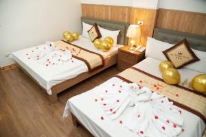 Postel nebo postele na pokoji v ubytování HOTTEL HÀ THÀNH