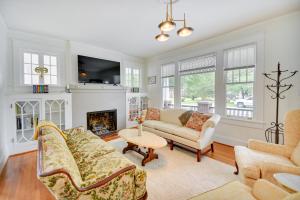 a living room with a couch and a fireplace at Elizabeth City Vacation Rental Gazebo with Hot Tub! in Elizabeth City