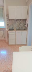 Kuchyň nebo kuchyňský kout v ubytování Tagghiate House + 23 fotografií
