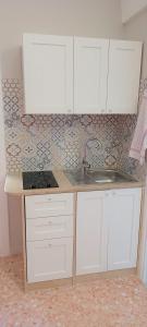 Kuchyň nebo kuchyňský kout v ubytování Tagghiate House