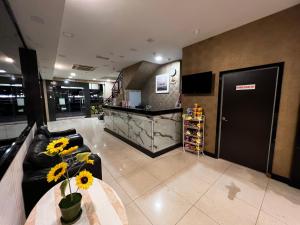 TV a/nebo společenská místnost v ubytování Signature Hotel