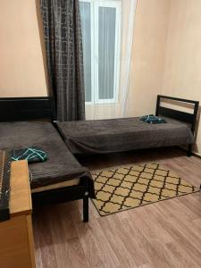 A bed or beds in a room at Дачный Домик на берегу озера Балхаш