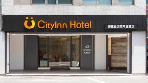 a store front of a cityium hotel on a street at CityInn Hotel Plus - Ximending Branch in Taipei