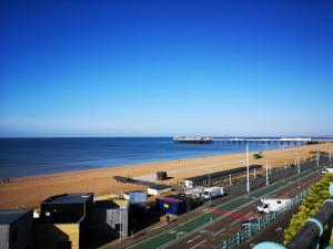 a view of a beach with a pier and the ocean at Number7, 3 minutes to the Beach, Super King Beds, Part of Burlington-Escapes in Brighton & Hove
