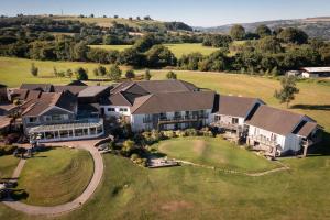 an aerial view of a large house on a field at Bryn Meadows Golf, Hotel & Spa in Blackwood