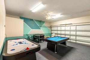 a play room with two pool tables in it at Tiger Lilly at Ellis Exclusive Villas in Kissimmee
