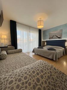 Łóżko lub łóżka w pokoju w obiekcie Hotel Regina