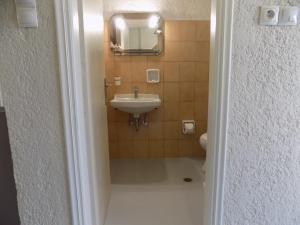 a bathroom with a sink and a mirror at Afrodite Spacious Apartments! in Agia Effimia +181 photos