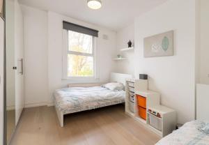 a bedroom with two beds and a window at Hendon home in Hendon