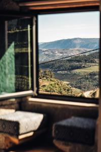 a window of a train looking out at the countryside at Casa do Santo - Wine & Tourism in Provesende