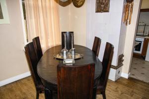 a dining room table and chairs in a room at Villa Del Mar in Jūrmala +11 photos