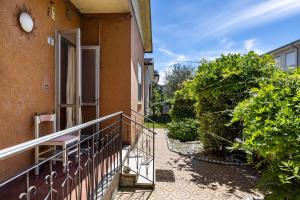 a balcony of a building with an open door at Casa Marina in Rosolina