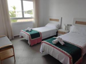 Postel nebo postele na pokoji v ubytování Moraira Beach 1