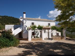 a white house sitting on top of a hill at Casas Rurales Cortijo Cerro Fuentes Nuevas in Castril