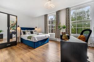 a bedroom with a bed and a large window at Host & Stay - Bedford Place in Liverpool