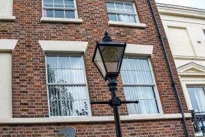 a street light in front of a brick building at Host & Stay - Bedford Place in Liverpool