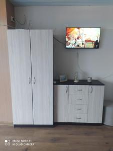 A television and/or entertainment centre at Exotic Guest House