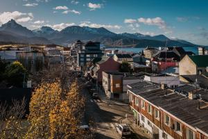 a view of a city with mountains in the background at Gente del Sur - Urbano Centro in Ushuaia