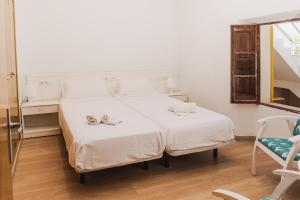 Łóżko lub łóżka w pokoju w obiekcie Sa Punta Dúplex Cala Ratjada