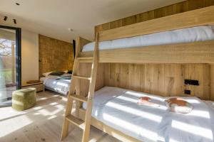 Postel nebo postele na pokoji v ubytování Wood (Forestia)