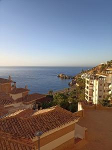 a view of the ocean from the roofs of buildings at ADNANIa 2023 in La Herradura