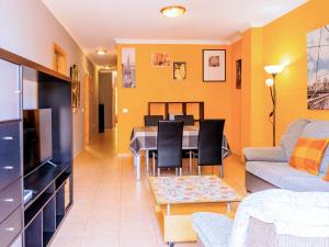 a living room with a table and a dining room at Live Puertito Almirante in Puertito de Güímar +33 photos