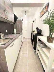 a kitchen with a sink and a counter top at Ein Traum im Leechwald nähe LKH in Graz