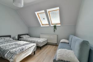 Кровать или кровати в номере Apartament Morski Rewa