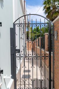 an entrance to a house with an iron gate at Villa Gina Case Vacanze in Roseto degli Abruzzi