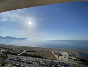 a view of a parking lot next to the water at Manhattan apartment in Empuriabrava