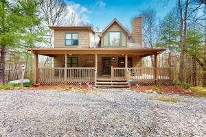 a large house with a porch and a driveway at Our Mountain Blessing - STR License #026,912 in Mashburn Mill