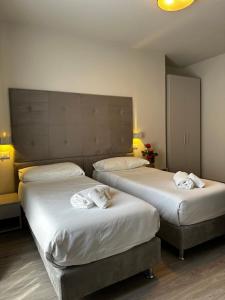Кровать или кровати в номере PFA Hotel Ginevra - Isola d'Elba