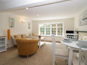 a living room with a couch and a table at The Cottage in Barrow in Furness