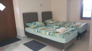 Postel nebo postele na pokoji v ubytování Apartman Lusi