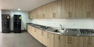 A kitchen or kitchenette at Hostelfc San Luis