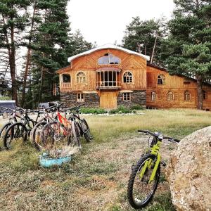 a group of bikes parked in front of a house at Hotel Tusheti in Omalo