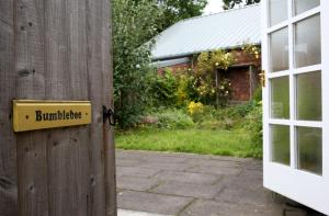 a house with a sign on the side of a door at The Torrs Apartments New Mills in New Mills