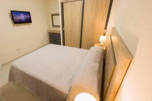 Posteľ alebo postele v izbe v ubytovaní Destino Deluxe Vera Playa - Laguna Beach + 13 fotografií
