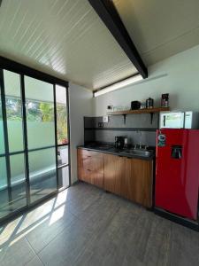 a kitchen with a red refrigerator in a room at Studio C Minerva zona residencial 1er piso in Guadalajara