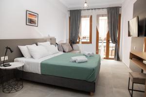a bedroom with a large bed with pillows on it at Vesta suite&studio in Chania Old Town in Chania Town