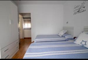 Postel nebo postele na pokoji v ubytování Vivienda con Fines Turísticos Salvador