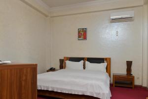 Postel nebo postele na pokoji v ubytování Antika Hotel