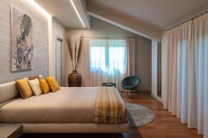 a bedroom with a large bed and a window at Villa Arianna Acireale in Acireale +48 photos