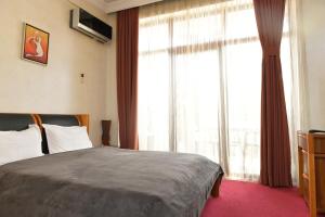 Postel nebo postele na pokoji v ubytování Antika Hotel