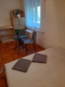 Posteľ alebo postele v izbe v ubytovaní Zöld Sziget Apartmanlakás